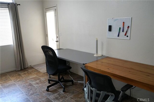 2068 Spy Glass Ct, Merced, CA 95340 - office area with dark stone finish flooring and baseboards