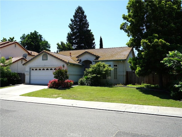 2068 Spy Glass Ct, Merced, CA 95340 - view of front of property featuring a tiled roof, a garage, concrete driveway, and stucco siding