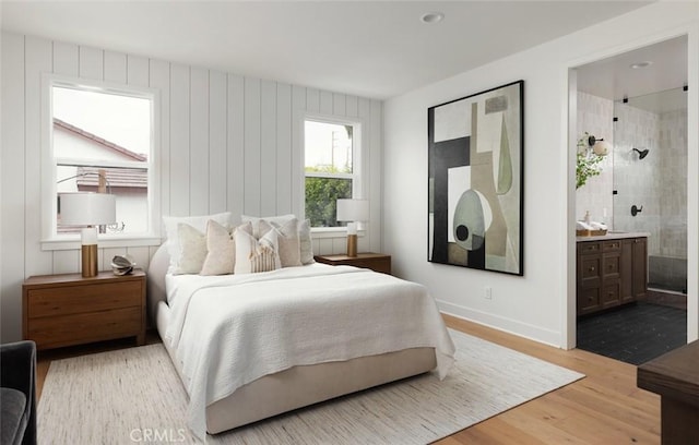 18017 Roch Ct, Fountain Valley, CA 92708 - bedroom featuring light wood-style floors, ensuite bath, and baseboards
