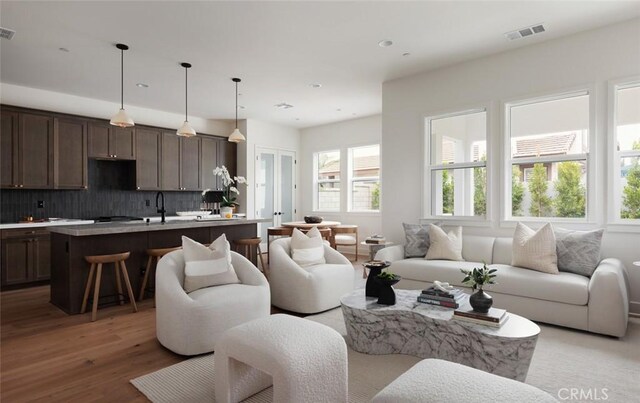 18017 Roch Ct, Fountain Valley, CA 92708 - living room featuring light wood finished floors and recessed lighting