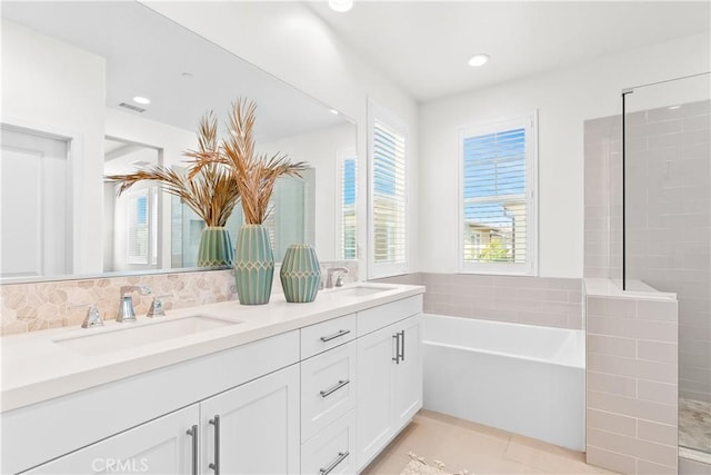28 Fosco St, Rancho Mission Viejo, CA 92694 - bathroom with double vanity, a bath, recessed lighting, tile patterned flooring, and tiled shower