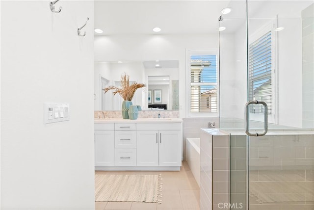 28 Fosco St, Rancho Mission Viejo, CA 92694 - full bath with double vanity, a garden tub, a shower stall, tile patterned floors, and recessed lighting
