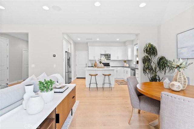 28 Fosco St, Rancho Mission Viejo, CA 92694 - dining space with light wood-type flooring and recessed lighting