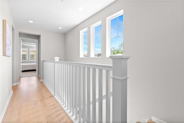 28 Fosco St, Rancho Mission Viejo, CA 92694 - hallway with light wood finished floors, an upstairs landing, recessed lighting, and baseboards