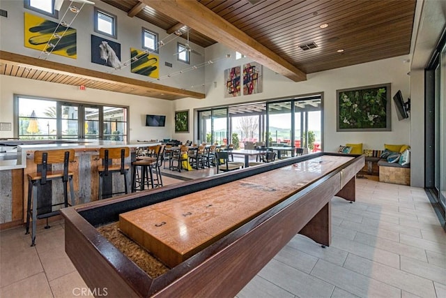 28 Fosco St, Rancho Mission Viejo, CA 92694 - recreation room with wood ceiling with exposed beams, healthy amount of natural light, light tile patterned floors, and recessed lighting