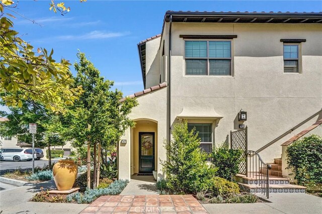 747 Spring Gdn, Irvine, CA 92618 - multi unit property with stucco siding and a tile roof