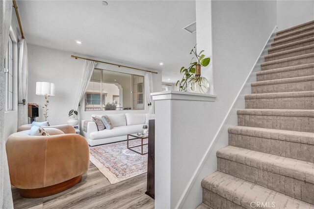 747 Spring Gdn, Irvine, CA 92618 - living area featuring stairway, wood finished floors, and recessed lighting