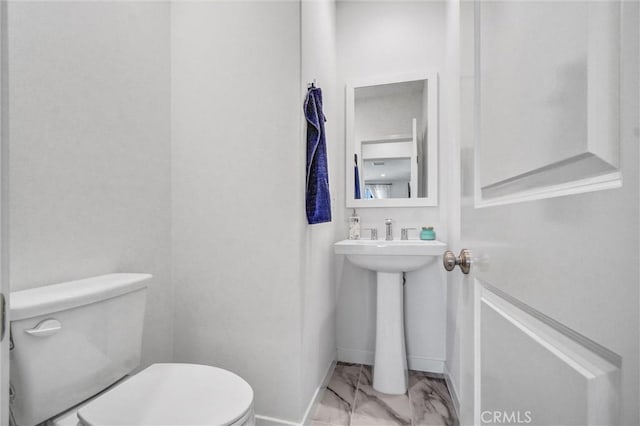 747 Spring Gdn, Irvine, CA 92618 - half bath featuring marble look tiles and toilet