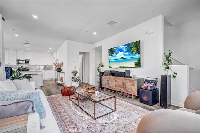 747 Spring Gdn, Irvine, CA 92618 - living room with light wood-style flooring, recessed lighting, and baseboards