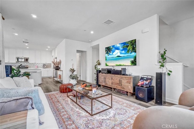 747 Spring Gdn, Irvine, CA 92618 - living area featuring light wood-style floors and recessed lighting
