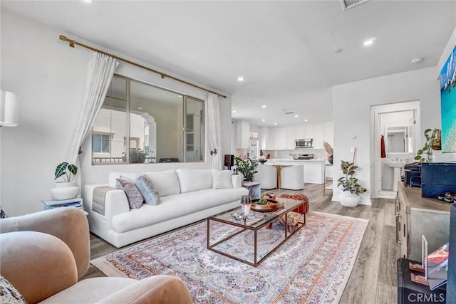 747 Spring Gdn, Irvine, CA 92618 - living room with light wood-style flooring and recessed lighting