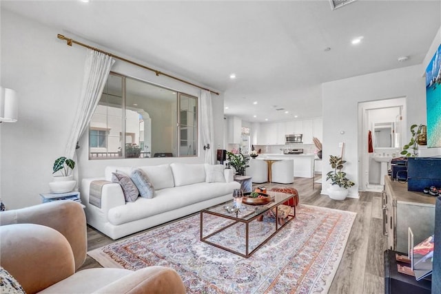 747 Spring Gdn, Irvine, CA 92618 - living room featuring light wood finished floors and recessed lighting
