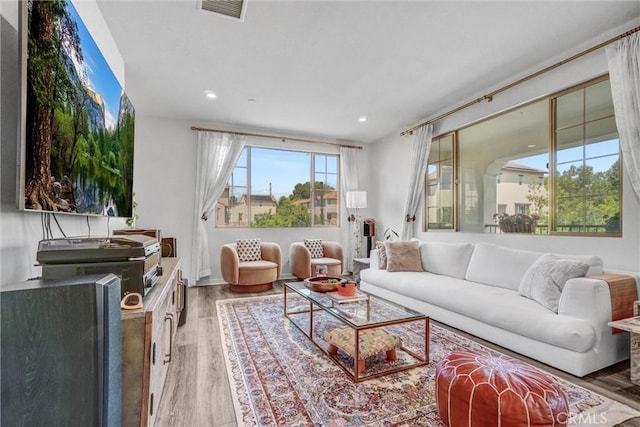 747 Spring Gdn, Irvine, CA 92618 - living room with wood finished floors and recessed lighting