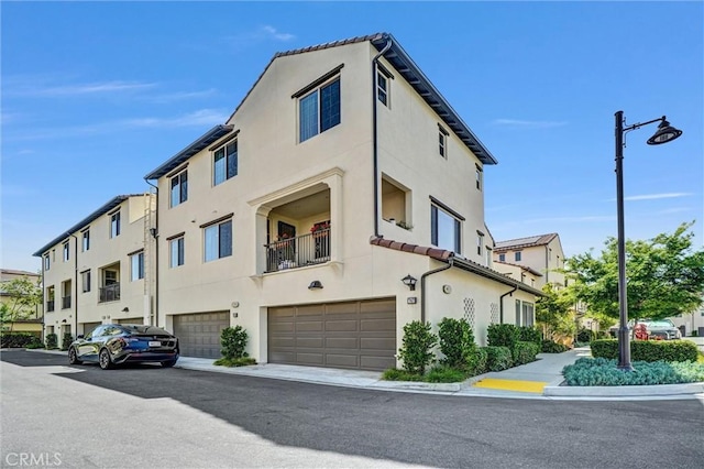747 Spring Gdn, Irvine, CA 92618 - view of building exterior featuring an attached garage