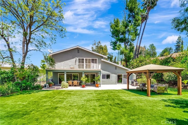 22668 Flamingo St, Woodland Hills, CA 91364 - rear view of house with a balcony, an outdoor living space, a gazebo, stucco siding, and a patio