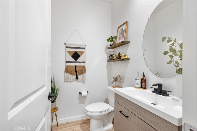 30893 Telegraph Dr, Winchester, CA 92596 - half bathroom with vanity, toilet, and wood finished floors