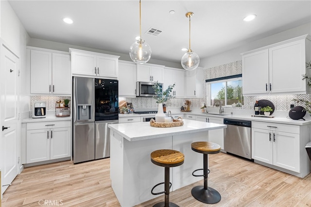 30893 Telegraph Dr, Winchester, CA 92596 - kitchen featuring stainless steel appliances, a sink, backsplash, recessed lighting, and light countertops