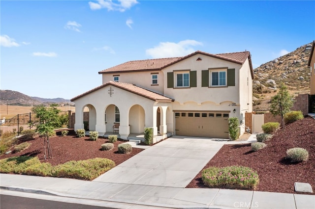 30893 Telegraph Dr, Winchester, CA 92596 - mediterranean / spanish house with stucco siding, an attached garage, a mountain view, driveway, and a tiled roof