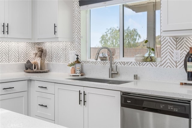 30893 Telegraph Dr, Winchester, CA 92596 - kitchen featuring stainless steel dishwasher, a sink, tasteful backsplash, and white cabinets