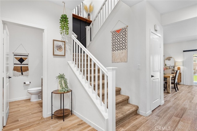 30893 Telegraph Dr, Winchester, CA 92596 - staircase with wood finished floors and baseboards