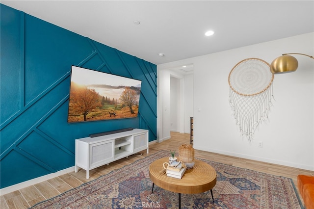 30893 Telegraph Dr, Winchester, CA 92596 - living room featuring wood finished floors, a decorative wall, baseboards, and recessed lighting