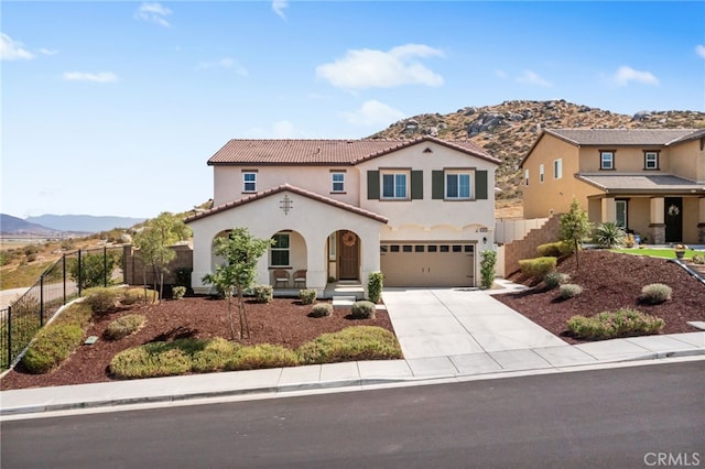 30893 Telegraph Dr, Winchester, CA 92596 - mediterranean / spanish-style home with a mountain view, stucco siding, an attached garage, and concrete driveway