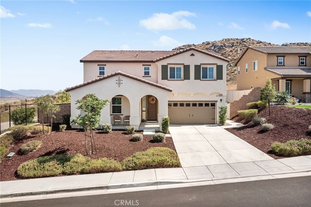30893 Telegraph Dr, Winchester, CA 92596 - mediterranean / spanish-style house featuring stucco siding, a mountain view, concrete driveway, covered porch, and a garage