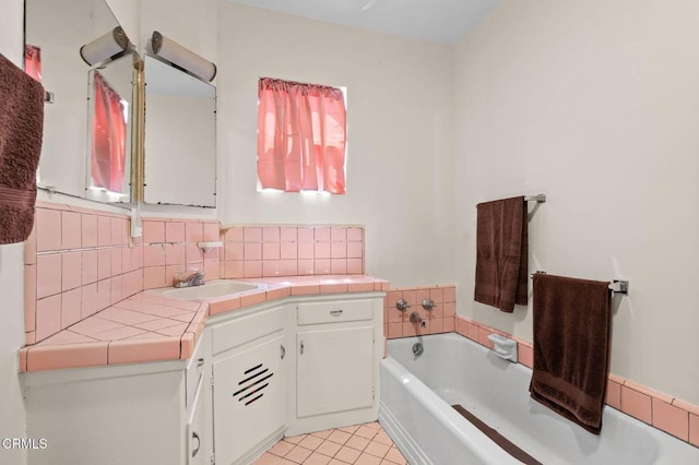 339 2nd St, Fillmore, CA 93015 - bathroom with a bath, vanity, tasteful backsplash, and tile patterned flooring
