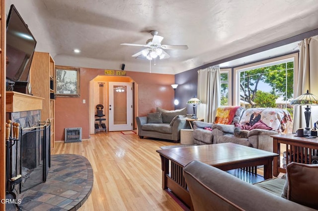 339 2nd St, Fillmore, CA 93015 - living area with light wood-type flooring, a ceiling fan, recessed lighting, a fireplace, and heating unit