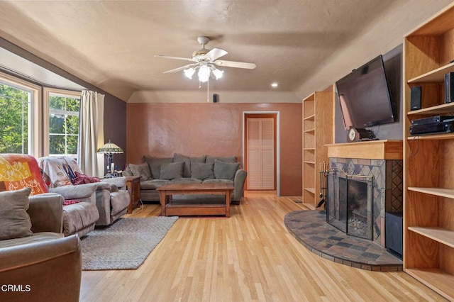 339 2nd St, Fillmore, CA 93015 - living area with light wood finished floors, a ceiling fan, and a stone fireplace