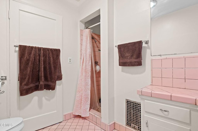 339 2nd St, Fillmore, CA 93015 - full bath with a shower stall, backsplash, tile patterned flooring, and toilet