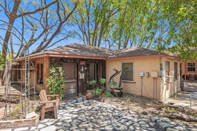 339 2nd St, Fillmore, CA 93015 - view of front of home featuring cooling unit, a patio, roof with shingles, and stucco siding