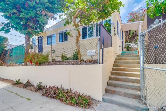 418 Dewey St, San Diego, CA 92113 - view of front facade featuring stucco siding