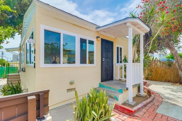 418 Dewey St, San Diego, CA 92113 - doorway to property featuring stucco siding