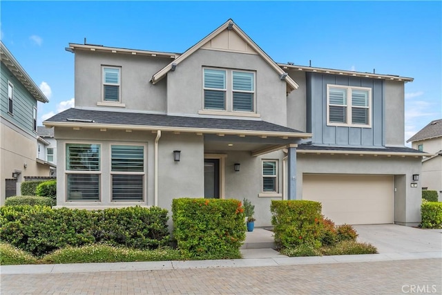 40 Jarano St, Rancho Mission Viejo, CA 92694 - traditional-style home featuring stucco siding, an attached garage, board and batten siding, and driveway