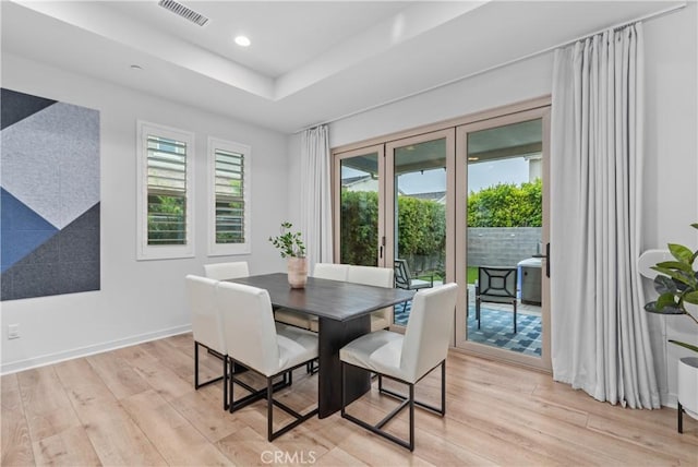 40 Jarano St, Rancho Mission Viejo, CA 92694 - dining space featuring light wood-type flooring, a raised ceiling, recessed lighting, and baseboards