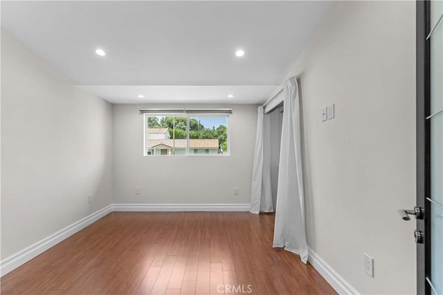 17206 Nugent Pl, Granada Hills, CA 91344 - unfurnished bedroom with wood finished floors, recessed lighting, and baseboards
