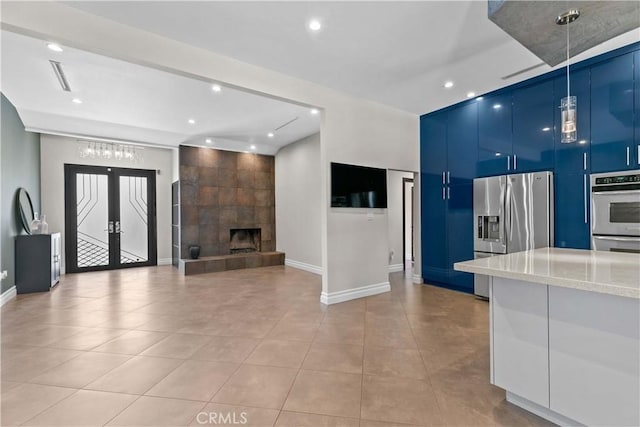 17206 Nugent Pl, Granada Hills, CA 91344 - unfurnished living room with recessed lighting, light tile patterned floors, baseboards, and french doors
