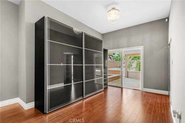 17206 Nugent Pl, Granada Hills, CA 91344 - unfurnished room featuring baseboards and wood finished floors