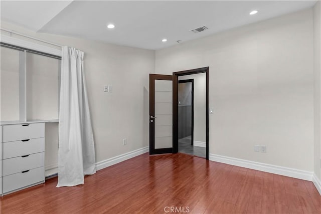 17206 Nugent Pl, Granada Hills, CA 91344 - unfurnished bedroom featuring baseboards, wood finished floors, and recessed lighting