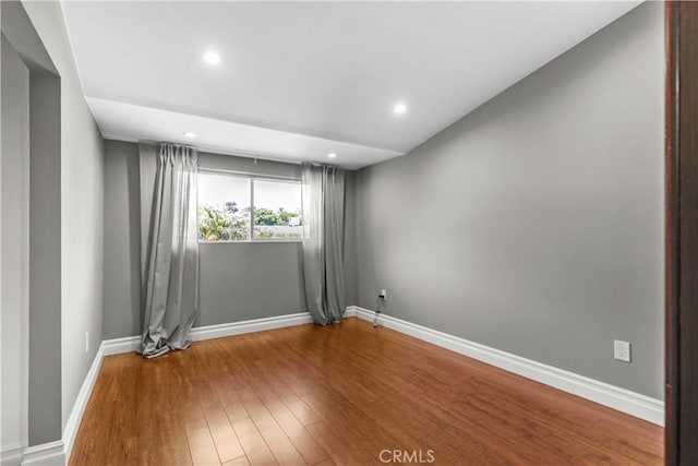 17206 Nugent Pl, Granada Hills, CA 91344 - spare room featuring wood finished floors, baseboards, and recessed lighting