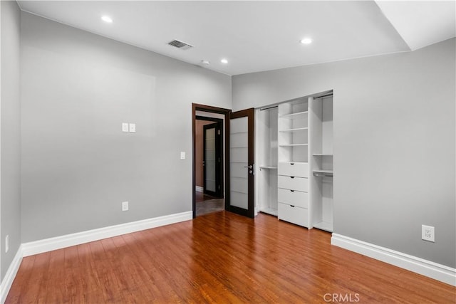 17206 Nugent Pl, Granada Hills, CA 91344 - unfurnished bedroom with wood finished floors, recessed lighting, and baseboards
