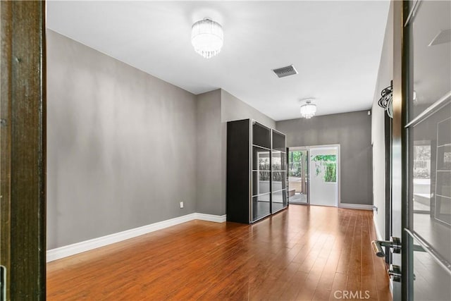 17206 Nugent Pl, Granada Hills, CA 91344 - empty room with wood finished floors and baseboards