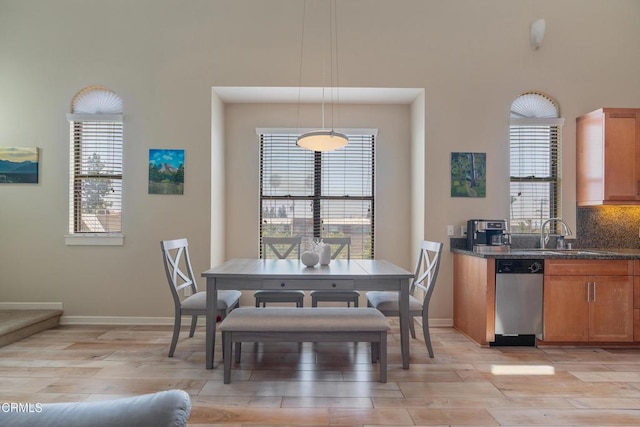 143 W Colorado Blvd, Monrovia, CA 91016 - dining space featuring light wood-style floors, healthy amount of natural light, and baseboards