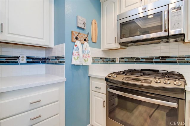 8788 Coral Springs Ct Unit 206A, Huntington Beach, CA 92646 - kitchen with stainless steel appliances, tasteful backsplash, light countertops, and white cabinets