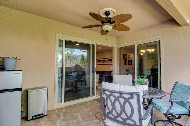 8788 Coral Springs Ct Unit 206A, Huntington Beach, CA 92646 - view of patio / terrace featuring a ceiling fan and outdoor dining area