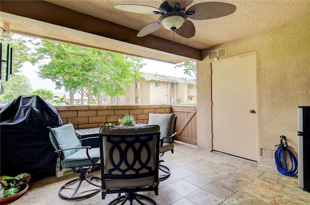 8788 Coral Springs Ct Unit 206A, Huntington Beach, CA 92646 - view of patio / terrace with ceiling fan and outdoor dining space