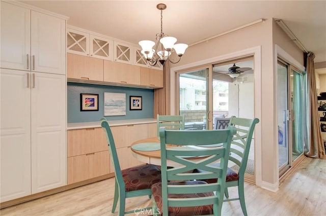 8788 Coral Springs Ct Unit 206A, Huntington Beach, CA 92646 - dining space featuring a chandelier and light wood-style flooring
