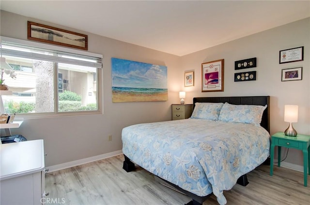 8788 Coral Springs Ct Unit 206A, Huntington Beach, CA 92646 - bedroom featuring light wood-style floors and baseboards