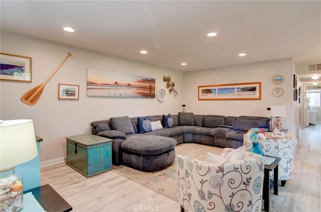 8788 Coral Springs Ct Unit 206A, Huntington Beach, CA 92646 - living area featuring wood finished floors, recessed lighting, and baseboards